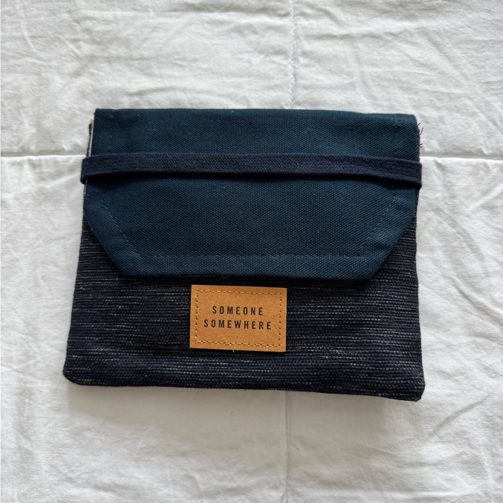 New, unused, artisan-made overnight travel essentials kit.